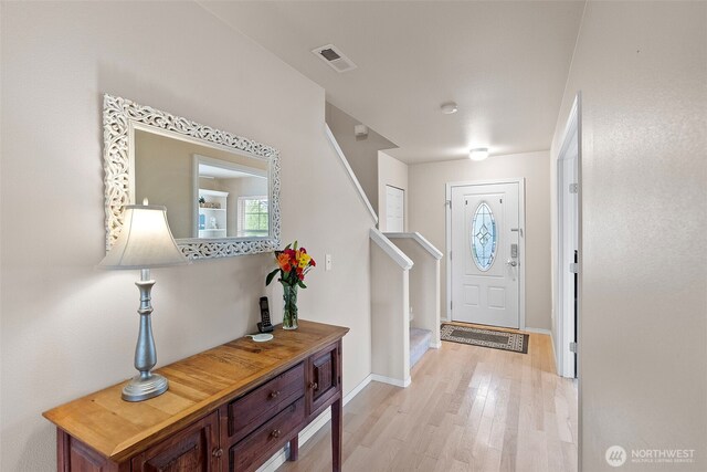 21032 Nordby Dr NW, Poulsbo, WA 98370 - entryway with stairs, light wood-style floors, healthy amount of natural light, and baseboards