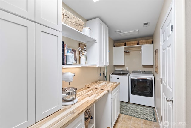 21032 Nordby Dr NW, Poulsbo, WA 98370 - laundry area with cabinet space and washer and clothes dryer