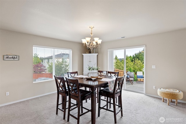 21032 Nordby Dr NW, Poulsbo, WA 98370 - dining area featuring a chandelier, plenty of natural light, and light carpet