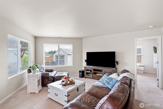 21032 Nordby Dr NW, Poulsbo, WA 98370 - living area featuring light colored carpet, healthy amount of natural light, and baseboards