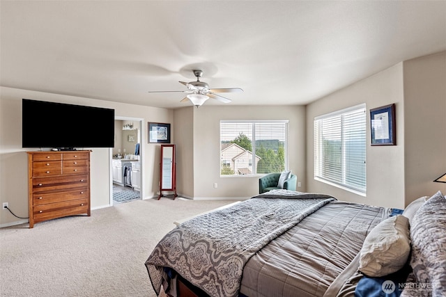 21032 Nordby Dr NW, Poulsbo, WA 98370 - bedroom featuring light colored carpet, baseboards, a ceiling fan, and ensuite bathroom