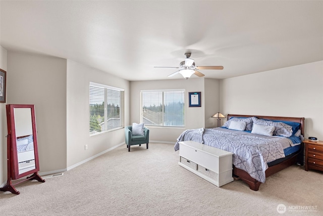 21032 Nordby Dr NW, Poulsbo, WA 98370 - bedroom with light carpet, baseboards, and a ceiling fan