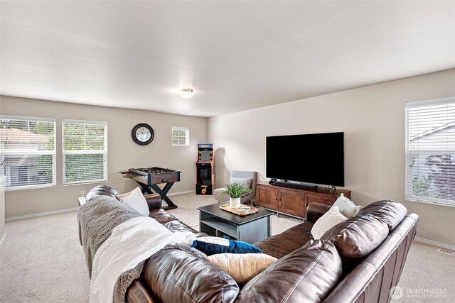 21032 Nordby Dr NW, Poulsbo, WA 98370 - living room with light colored carpet, healthy amount of natural light, and baseboards