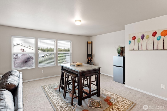 21032 Nordby Dr NW, Poulsbo, WA 98370 - dining area featuring light colored carpet and baseboards