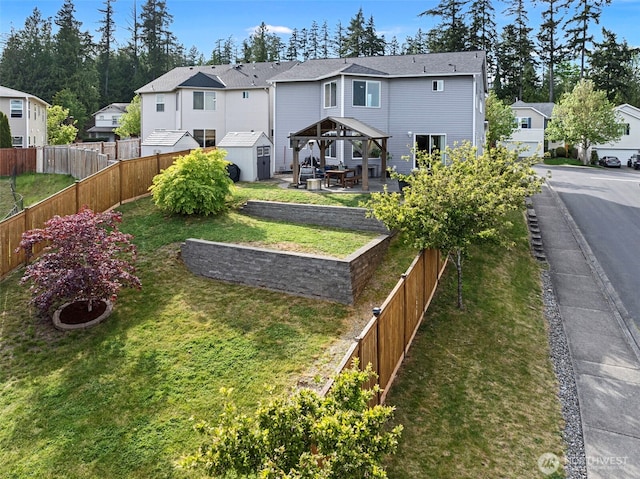 21032 Nordby Dr NW, Poulsbo, WA 98370 - rear view of house with a gazebo, a storage unit, an outbuilding, and a residential view