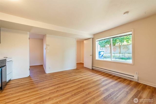 2630 58th Ave SW Unit 1-4, Seattle, WA 98116 - unfurnished living room with a baseboard heating unit, light wood-style flooring, and baseboards