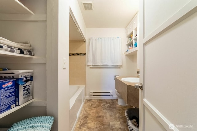 2630 58th Ave SW Unit 1-4, Seattle, WA 98116 - full bath featuring a baseboard radiator, vanity, and stone finish floors