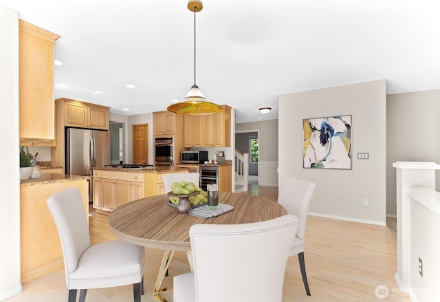 6336 286th Pl NE, Carnation, WA 98014 - dining space with beverage cooler, light wood-style flooring, baseboards, and recessed lighting
