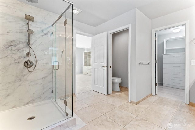 6336 286th Pl NE, Carnation, WA 98014 - bathroom with a marble finish shower, toilet, and tile patterned flooring