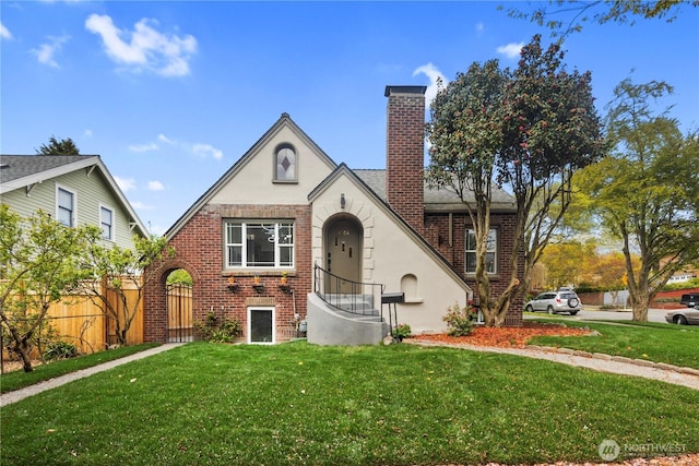 1602 NW 83rd St, Seattle, WA 98117 - tudor house with brick siding, stucco siding, and a chimney