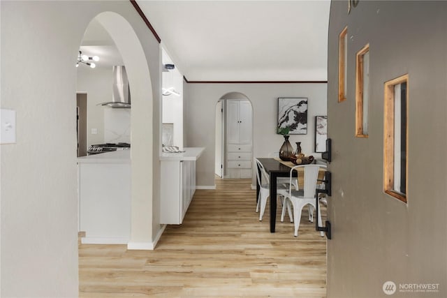 1602 NW 83rd St, Seattle, WA 98117 - hall featuring light wood finished floors, arched walkways, and baseboards
