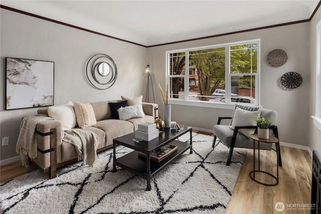1602 NW 83rd St, Seattle, WA 98117 - living room featuring crown molding, baseboards, and wood finished floors