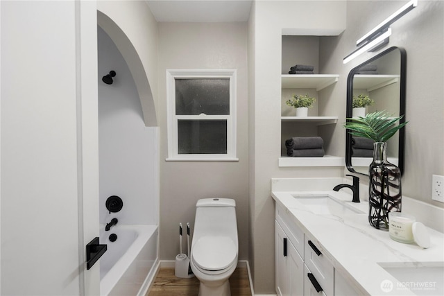 1602 NW 83rd St, Seattle, WA 98117 - full bathroom with wood finished floors, a tub to relax in, double vanity, toilet, and a shower