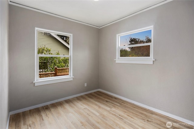 1602 NW 83rd St, Seattle, WA 98117 - unfurnished room featuring plenty of natural light, ornamental molding, baseboards, and wood finished floors