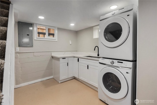 1602 NW 83rd St, Seattle, WA 98117 - laundry room with a sink, electric panel, stacked washing machine and dryer, concrete block wall, and recessed lighting