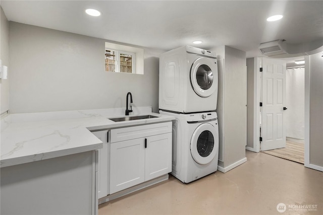 1602 NW 83rd St, Seattle, WA 98117 - clothes washing area with stacked washer / drying machine, a sink, recessed lighting, and baseboards