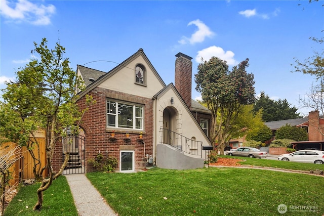 1602 NW 83rd St, Seattle, WA 98117 - tudor home with brick siding, a chimney, and stucco siding