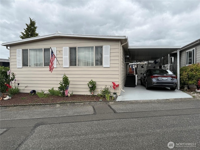 1415 84th St SE Unit 45, Everett, WA 98208 - manufactured / mobile home featuring a carport and concrete driveway