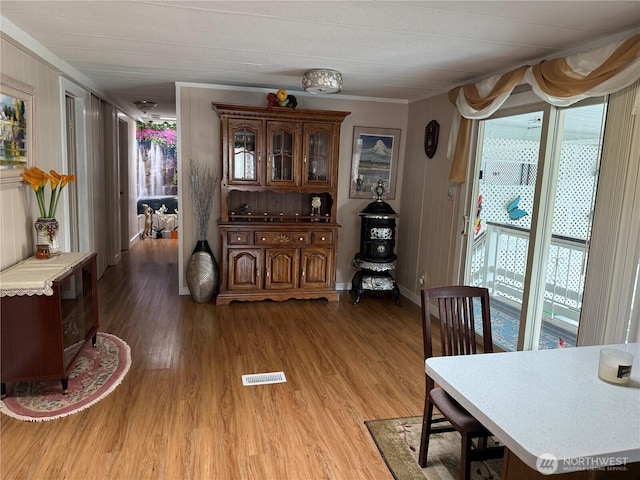 1415 84th St SE Unit 45, Everett, WA 98208 - dining room featuring crown molding, light wood-type flooring, and baseboards