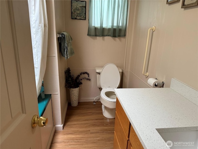 1415 84th St SE Unit 45, Everett, WA 98208 - bathroom with toilet, wood finished floors, vanity, and baseboards