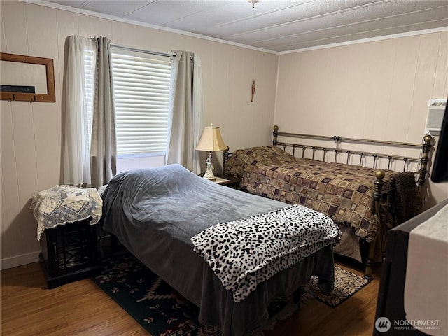 1415 84th St SE Unit 45, Everett, WA 98208 - bedroom with ornamental molding, wood finished floors, and a decorative wall