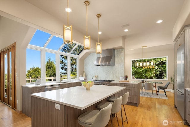 5874 169th Ave SE, Bellevue, WA 98006 - kitchen featuring wall chimney range hood, a center island, modern cabinets, dishwasher, and light countertops