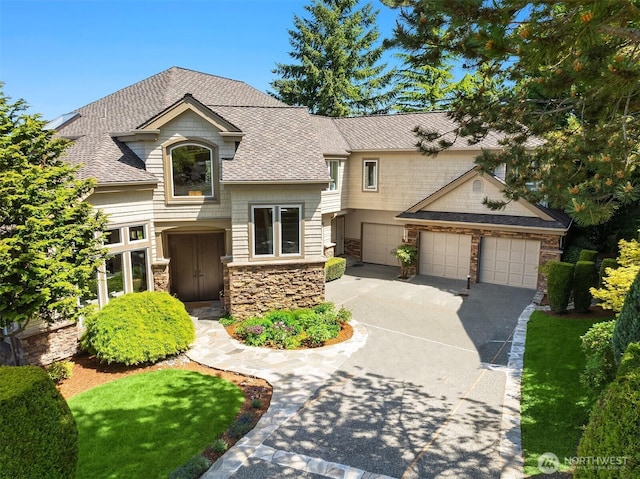 5874 169th Ave SE, Bellevue, WA 98006 - view of front facade with stone siding, asphalt driveway, roof with shingles, and an attached garage