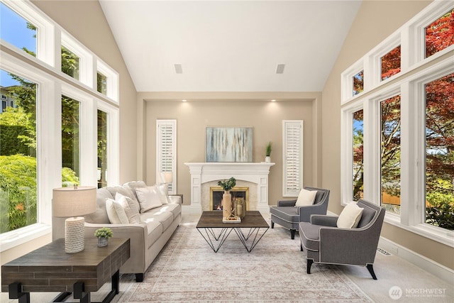 5874 169th Ave SE, Bellevue, WA 98006 - living room featuring high vaulted ceiling, plenty of natural light, a fireplace, and baseboards