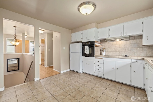 kitchen with black appliances, backsplash, white cabinetry, and baseboards