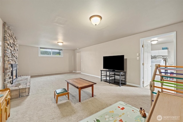 living area featuring carpet floors and baseboards