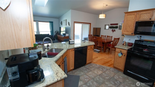 71 E N Bay Pl, Allyn, WA 98524 - kitchen featuring black appliances, a sink, vaulted ceiling, decorative light fixtures, and light stone counters