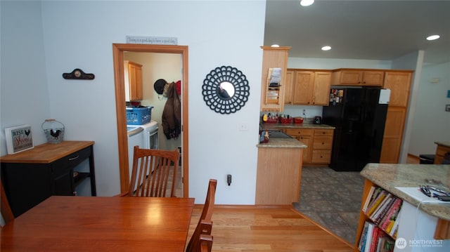 71 E N Bay Pl, Allyn, WA 98524 - kitchen featuring freestanding refrigerator, separate washer and dryer, recessed lighting, and wood finished floors