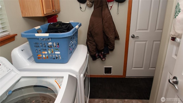 71 E N Bay Pl, Allyn, WA 98524 - laundry room with washer and clothes dryer and cabinet space