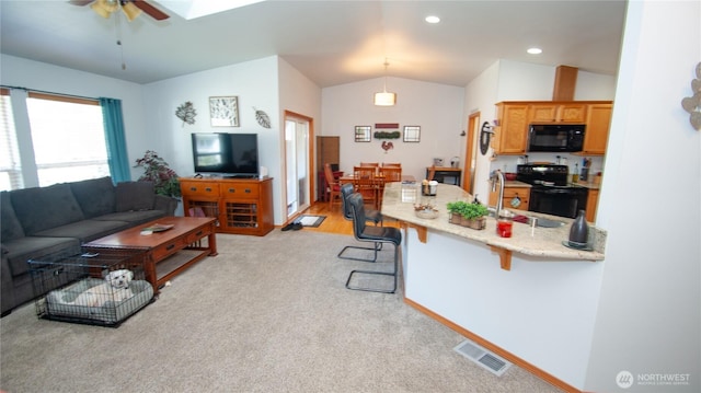 71 E N Bay Pl, Allyn, WA 98524 - living area with lofted ceiling, a ceiling fan, light carpet, and recessed lighting