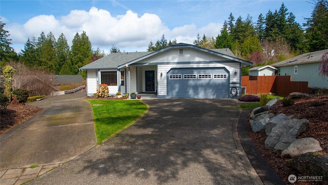 71 E N Bay Pl, Allyn, WA 98524 - ranch-style house with asphalt driveway and a garage