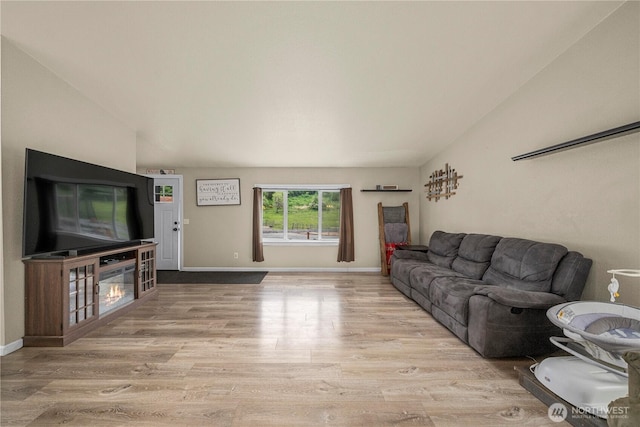 882 Independence Rd, Rochester, WA 98579 - living area featuring wood finished floors, baseboards, and lofted ceiling