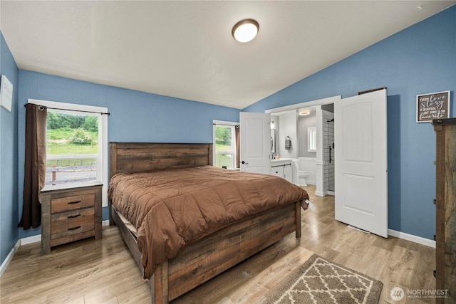 882 Independence Rd, Rochester, WA 98579 - bedroom featuring lofted ceiling, multiple windows, light wood-style flooring, ensuite bath, and baseboards