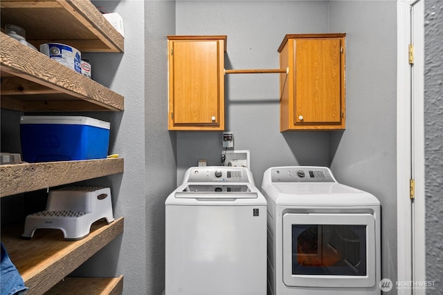882 Independence Rd, Rochester, WA 98579 - clothes washing area featuring separate washer and dryer and cabinet space