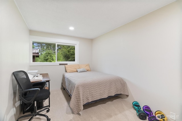 bedroom featuring light colored carpet, a desk, and recessed lighting