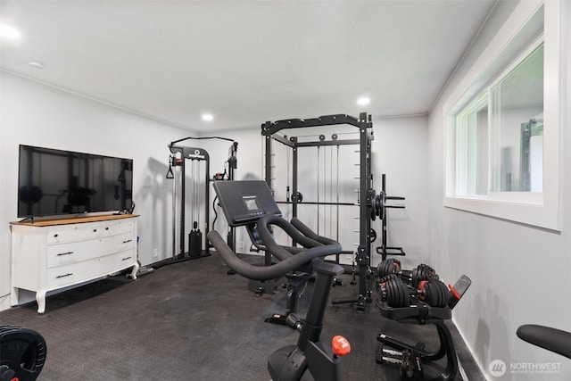 exercise area with baseboards and recessed lighting