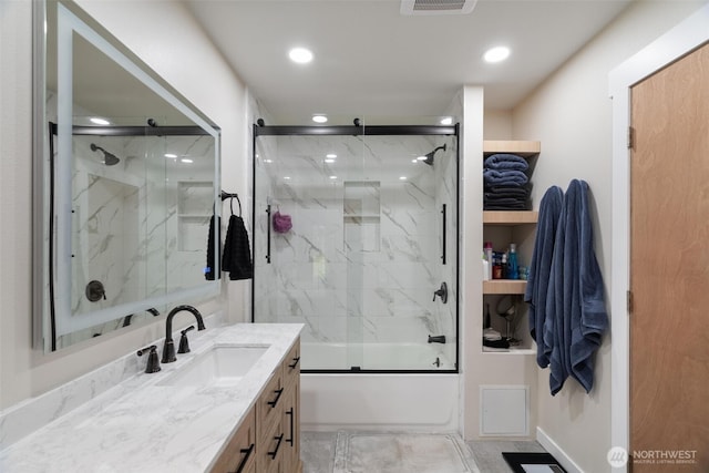 full bath with bath / shower combo with glass door, vanity, and recessed lighting