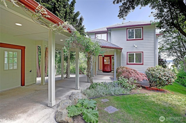 955 Michael Way, Camano Island, WA 98282 - view of front of property featuring covered porch, a front yard, and a shingled roof