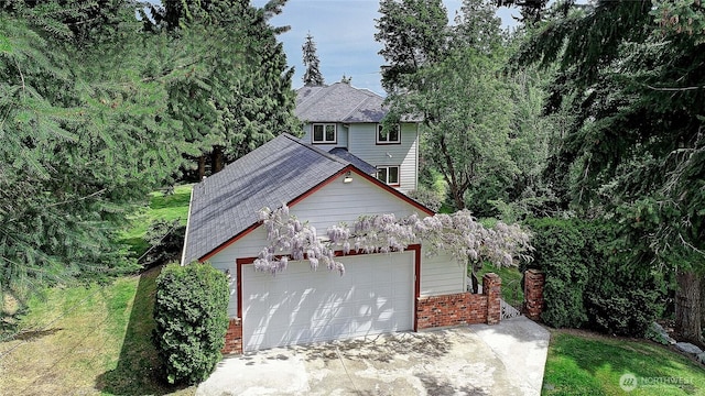 955 Michael Way, Camano Island, WA 98282 - view of front of home featuring brick siding, roof with shingles, and concrete driveway