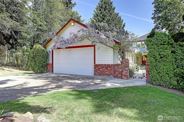 955 Michael Way, Camano Island, WA 98282 - view of front of property featuring brick siding, driveway, an attached garage, and a front lawn