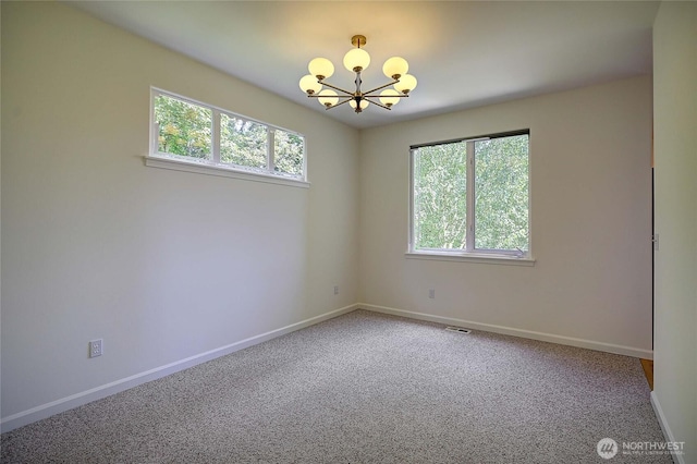 955 Michael Way, Camano Island, WA 98282 - spare room featuring a chandelier, plenty of natural light, and baseboards
