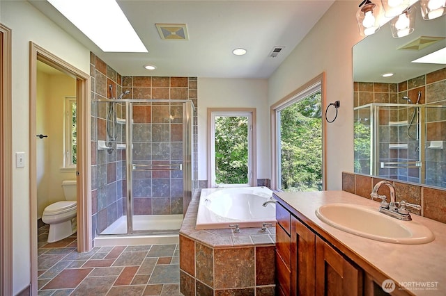 955 Michael Way, Camano Island, WA 98282 - bathroom featuring a shower stall, toilet, a bath, vanity, and stone finish flooring