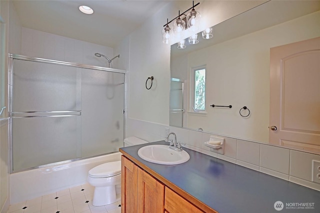 955 Michael Way, Camano Island, WA 98282 - bathroom featuring toilet, vanity, combined bath / shower with glass door, tile patterned flooring, and recessed lighting