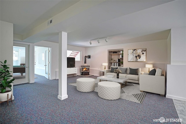 955 Michael Way, Camano Island, WA 98282 - living area with a wood stove, baseboards, and carpet