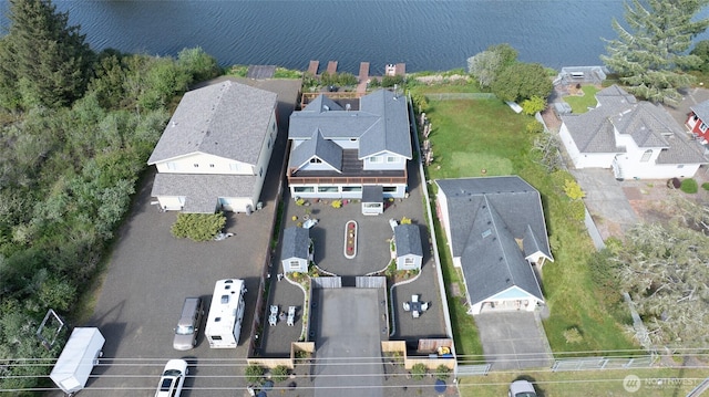 aerial overview of property's location featuring nearby suburban area and a large body of water