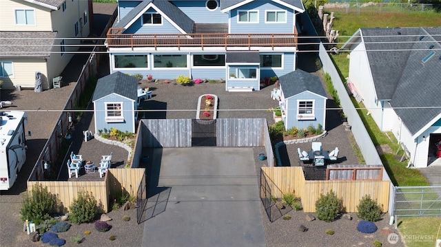view of front facade with fence and a residential view